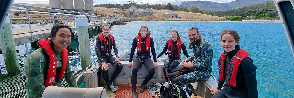 Vice-Chancellor Professor Rufus Black and students at Maria Island. Credit: Rick Stuart-Smith